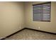 Neutral colored bedroom featuring a large window that provides plenty of natural light at 15625 N Jerry St, Surprise, AZ 85378