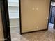 Bedroom featuring a walk-in closet and a view of a decorated front door at 15625 N Jerry St, Surprise, AZ 85378