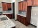 This kitchen has granite countertops, custom cabinetry, and stainless appliances at 15625 N Jerry St, Surprise, AZ 85378