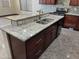 This kitchen has granite countertops, stainless appliances, and custom cabinetry at 15625 N Jerry St, Surprise, AZ 85378