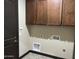 Laundry room featuring wood cabinets and all the connections for a washer and dryer at 15625 N Jerry St, Surprise, AZ 85378