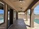Covered patio with ceiling fans overlooking pool and backyard area at 15625 N Jerry St, Surprise, AZ 85378