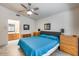 Main bedroom with ensuite bathroom, matching night stands and an oak vanity at 17317 N Ponca Way, Surprise, AZ 85374