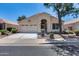 Charming single-story home with a well-maintained front yard and attached two-car garage at 17317 N Ponca Way, Surprise, AZ 85374