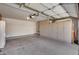 Spacious garage with built-in storage cabinets and a clean, organized appearance at 17317 N Ponca Way, Surprise, AZ 85374