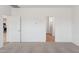 Bedroom with neutral carpeting, adjoining doorways, and ample natural light at 17830 W Vogel Ave, Waddell, AZ 85355
