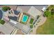 Aerial view of home showcasing a large lot with refreshing pool, sport court, RV parking, and solar panels at 1932 S 220Th Dr, Buckeye, AZ 85326