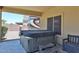 Back patio with a hot tub at 1932 S 220Th Dr, Buckeye, AZ 85326