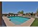 A backyard featuring a refreshing pool, artificial turf and desert landscaping at 1932 S 220Th Dr, Buckeye, AZ 85326