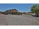 Spacious backyard featuring an RV, pool, and sport court at 1932 S 220Th Dr, Buckeye, AZ 85326