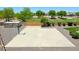 Large concrete basketball court alongside extra storage space at 1932 S 220Th Dr, Buckeye, AZ 85326