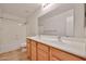 Bathroom featuring double sinks, tile floor, and a shower/tub combo at 1932 S 220Th Dr, Buckeye, AZ 85326