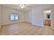 Bedroom with a ceiling fan, carpet flooring, and bright natural light at 1932 S 220Th Dr, Buckeye, AZ 85326