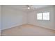 Bedroom with carpet, natural light from one window, and neutral walls at 1932 S 220Th Dr, Buckeye, AZ 85326