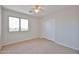 Neutral bedroom featuring carpet, ceiling fan, and a closet with sliding doors at 1932 S 220Th Dr, Buckeye, AZ 85326