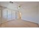 Bedroom featuring a ceiling fan, neutral walls, carpet, and sliding door closet at 1932 S 220Th Dr, Buckeye, AZ 85326