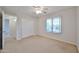 Bedroom with a closet, ceiling fan, and window showcasing natural light at 1932 S 220Th Dr, Buckeye, AZ 85326