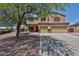 Spacious two-story home featuring a three-car garage and well-maintained landscaping at 1932 S 220Th Dr, Buckeye, AZ 85326