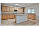 Well-lit kitchen featuring granite countertops, stainless steel appliances, and custom cabinetry at 1932 S 220Th Dr, Buckeye, AZ 85326