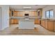 Bright kitchen featuring stainless appliances, granite counters, and an island at 1932 S 220Th Dr, Buckeye, AZ 85326