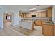 Spacious kitchen with stainless steel appliances, granite countertops, and an island at 1932 S 220Th Dr, Buckeye, AZ 85326