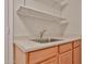 Laundry room area with sink, counter and wood cabinets at 1932 S 220Th Dr, Buckeye, AZ 85326