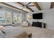 Bright and inviting bedroom boasts exposed ceiling beams and many bright, sunlit windows at 19748 E Walnut Rd, Queen Creek, AZ 85142