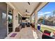 A covered patio with outdoor seating and a view of the pool at 19748 E Walnut Rd, Queen Creek, AZ 85142