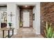 Grand foyer featuring stone accent wall, tile flooring, and neutral colors, creating a sophisticated entry at 19748 E Walnut Rd, Queen Creek, AZ 85142