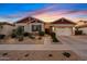 Charming single-Gathering home with desert landscaping, a two-car garage and inviting curb appeal at 19748 E Walnut Rd, Queen Creek, AZ 85142