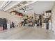 Well-organized garage with storage racks, shelves, and ample space for vehicles and tools at 19748 E Walnut Rd, Queen Creek, AZ 85142