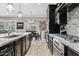 Spacious kitchen showcases granite countertops, stainless steel appliances, and ample cabinet space for culinary enthusiasts at 19748 E Walnut Rd, Queen Creek, AZ 85142