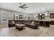 Open-concept living room boasts abundant natural light, comfortable seating, and a seamless flow to the kitchen at 19748 E Walnut Rd, Queen Creek, AZ 85142