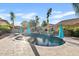 Backyard oasis featuring a sparkling pool, lush landscaping, and a serene outdoor living space at 19748 E Walnut Rd, Queen Creek, AZ 85142
