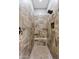 Tiled walk-in shower features a shower bench and modern shower head fixture at 19748 E Walnut Rd, Queen Creek, AZ 85142
