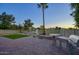 Paver patio with a built-in grill, artificial grass, and golf course views at 19906 N 76Th Ave, Glendale, AZ 85308