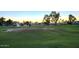 Beautiful golf course view with lush green grass and mature trees at 19906 N 76Th Ave, Glendale, AZ 85308