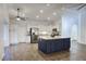 Open concept kitchen with a large island, stainless steel appliances, and updated cabinetry at 19906 N 76Th Ave, Glendale, AZ 85308