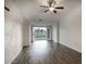 Bright living room with backyard access and wood-look floors, offering seamless indoor-outdoor living at 19906 N 76Th Ave, Glendale, AZ 85308