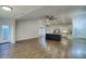 Open living space with a kitchen island, stainless steel appliances, and a view of the backyard at 19906 N 76Th Ave, Glendale, AZ 85308