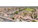 Spacious aerial view of the home with solar panels, a pool, a desert landscape, and a two-car garage at 20655 N 273Rd Ave, Buckeye, AZ 85396