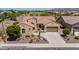 Charming home with a well-maintained yard, desert landscaping, and a view of the neighborhood golf course at 20655 N 273Rd Ave, Buckeye, AZ 85396
