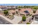 Expansive aerial view of a home with solar panels, manicured desert landscaping, and a three-car garage at 20655 N 273Rd Ave, Buckeye, AZ 85396