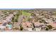 Expansive aerial view of a golf community featuring desert landscaping and homes with solar panels at 20655 N 273Rd Ave, Buckeye, AZ 85396