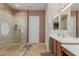 Bathroom featuring a glass-enclosed shower, neutral wall colors, and tile floor at 20655 N 273Rd Ave, Buckeye, AZ 85396