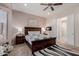 Comfortable bedroom with bedside tables, lamps, and a striped rug at 20655 N 273Rd Ave, Buckeye, AZ 85396
