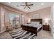 Serene bedroom with cozy rocking chair and large window at 20655 N 273Rd Ave, Buckeye, AZ 85396