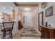 Open foyer with tile flooring, a stylish rug, and views into the kitchen and living areas at 20655 N 273Rd Ave, Buckeye, AZ 85396
