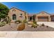 Charming front exterior with desert landscaping including cacti and a low-maintenance gravel yard at 20655 N 273Rd Ave, Buckeye, AZ 85396