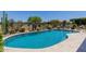 Sparkling pool surrounded by desert landscaping, cacti, and a black metal fence at 20655 N 273Rd Ave, Buckeye, AZ 85396